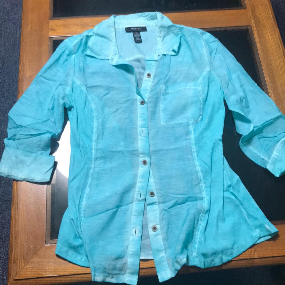 Turquoise shirt that’s a button up